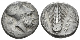 Lucania, Metapontum Nomos circa 340-330, AR 18mm., 7.55g. Head of Leucippus r., wearing Corinthian helmet; behind, lion's head r. Rev. Ear of barley w...