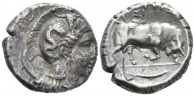 Lucania, Thurium Di-nomos circa 350-300, AR 25mm., 15.43g. Head of Athena r., wearing crested Corinthian helmet decorated with Scylla throwing a stone...