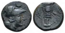 Apulia, Caelia Uncia circa 220-150,, Æ 14mm., 1.86g. Head of Athena r, wearing crested Corinthian helmet; above, one pellet. Rev. Trophy; in l. field,...