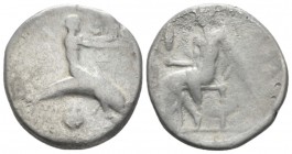 Calabria, Tarentum Nomos circa 450 BC, AR 21mm., 6.40g. Dolphin rider r., extending arms; below, shell. Rev. Oecist seated l., holding distaff. and st...