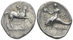 Calabria, Tarentum Nomos circa 280-272, AR 23mm., 5.80g. Nude youth crowning horse he rides r. Rev. Oecist holding helmet, riding dolphin l.; in field...
