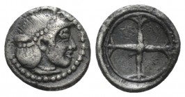 Sicily, Syracuse Litra circa 480-470, AR 9.6mm., 0.70g. Head of nymph Arethusa r. Rev. Wheel of four spokes. Boehringer 368. SNG ANS 116.

Nice old ...