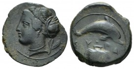 Sicily, Syracuse Hemilitron circa 415-405, Æ 17mm., 2.31g. Head of Arethusa l., hair bound in ampyx and sphendone; two leaves to r. Rev. Dolphin swimm...