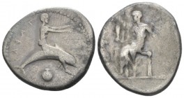 Calabria, Tarentum Nomos circa 405, AR 22mm., 7.60g. Dolphin rider r., extending arms; below, shell. Rev. Oecist seated l., holding distaff. And staff...