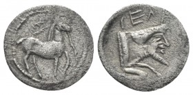 Sicily, Gela Litra circa 465-450, AR 12mm., 0.43g. Horse standing r. with reins trailing from mouth; in field above, wreath. Rev. Forepart of man-head...