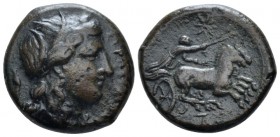 Sicily, Syracuse Bronze circa 317-289,, Æ 18mm., 8.84g. Wreathed head of Persephone l. Rev. Female, holding kentron in right hand, reins in l., drivin...