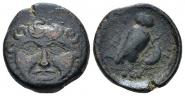 Sicily, Camarina Tetras circa 420-410, Æ 18mm., 3.72g. Facing head of Gorgoneion. Rev. Owl standing r., holding lizard. In exergue, below, three pelle...