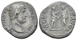 Hadrian, 117-138 Denarius circa 134-138, AR 17mm., 3.33g. Laureate head r. Rev. Roma standing r., holding spear and clasping hands with Hadrian standi...