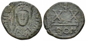 Tiberius II, 578-582 Half Follis circa 578-582, Æ 20mm., 4.70g. Crowned and cuirassed facing bust, holding globus cruciger and shield decorated with h...