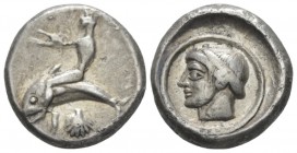 Calabria, Tarentum Nomos circa 470-465, AR 18mm., 7.62g. Oecist seated on dolphin l.; below, shell. Rev. Female head l. (Satyra ?) within linear circl...