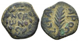 Judaea, Porcius Festus, 59-62. Jerusalem Prutah circa 58-59 (year 5 of Nero), Æ 16mm., 2.36g. NЄP/ωNO/C in three lines within wreath. Rev. Palm frond;...