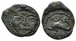Hispania, Gadir 1/4 Unit 2nd half II cent., Æ 15.4mm., 1.68g. Facing head of Helios Rev. Dolphin swimming r. CNH 43. MH 80.

Green patina, Good Very...