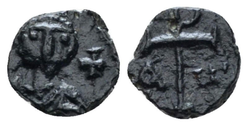 Justinian I, 527-565. Nummus Carthage circa 534-565, Æ 7mm., 0.43g. Helmeted and...