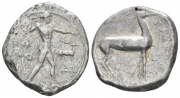 Bruttium, Caulonia Nomos circa 475-425, AR 20.00 mm., 7.76 g.
Apollo standing r., holding branch in r. hand; in field r., stag. Behind, leaf. Rev. St...
