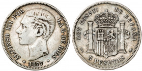 1877*1877. Alfonso XII. DEM. 5 pesetas. (AC. 38). 2ª estrella floja. Contramarca particular RG. 24,77 g. BC+.