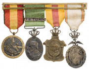 (Pérez Guerra 817, 828, 838 y 875). Conjunto de 4 condecoraciones militares, unidas por un pasador. EBC.
