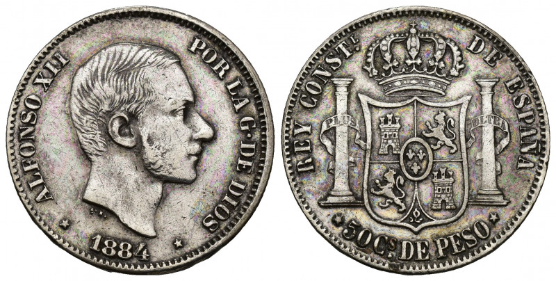 ALFONSO XII. 50 centavos de peso. 1884. Manila. AR 12,84 g. 29,8 mm. VII-79. Lim...