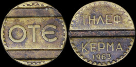 GREECE: Brass token. Inscription "ΟΤΕ" on obverse. Inscription "ΤΗΛΕΦ. ΚΕΡΜΑ / 1963" on reverse. Medal Alignment. Diameter: 19mm. Weight: 3,8gr. Extre...