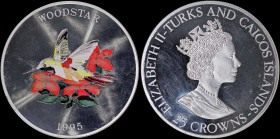 TURKS & CAICOS ISLANDS: 25 Crowns (1995) in silver (0,999) with crowned bust of Queen Elizabeth II facing right. Multicolor Woodstar bird on reverse. ...
