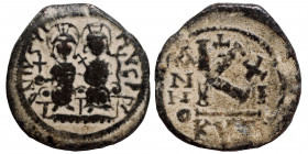 Justin II, with Sophia, 565-578. Half Follis (bronze, 4.56 g, 23 mm), Cyzicus, dated RY 11 (575/6). Justin, holding globus cruciger, and Sophia, holdi...