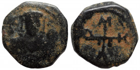 Manuel I Comnenus, 1143-1180. Half Tetarteron (bronze, 1.76 g, 15 mm), uncertain mint, 1143-1152. Monogram of Manuel I Comnenus. Rev. Half-length bust...