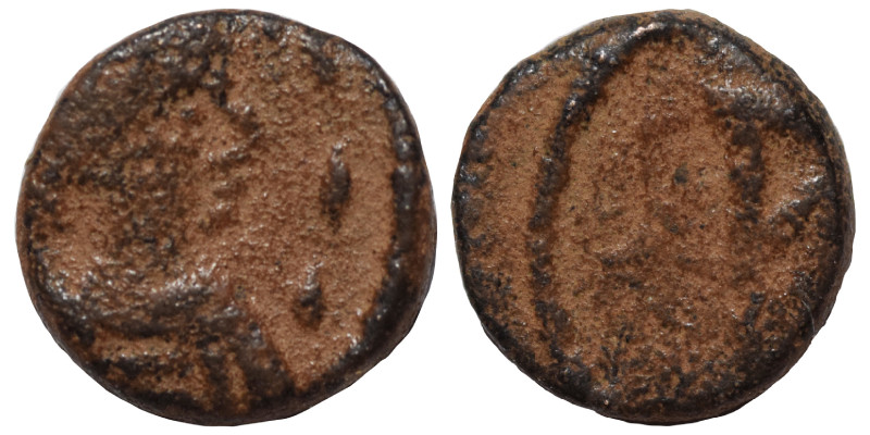 VANDALS (?). Nummus (bronze, 0.39 g, 8 mm). Pearl-diademed and draped bust right...