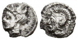 CILICIA, Tarsos. Obolo. (Ar. 0,53g/9mm). 384-360 a.C. (SNG France 278 var). Anv: Cabeza femenina a izquierda. Rev: Cabeza barbada de Ares a izquierda ...