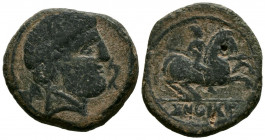 CONTERBIA CARBICA (Huete, Cuenca). As. (Ae. 13,65g/28mm). 120-80 a.C. (FAB-850). Anv: Busto masculino a derecha con barba, delante delfín, detrás letr...