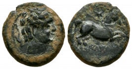 ILTIRTA (Lérida). Cuadrante. (Ae. 3,06g/16mm). 200-20 a.C. (FAB-1468). Anv: Cabeza masculina a derecha, alrededor de tres delfines. Rev: Caballo salta...