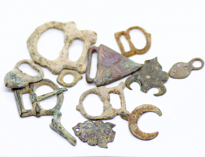 Lot of Ancient Roman Bronze Belt buckles and belt pieces. Very attractive in fin...