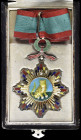 China, Republic, Order of the Striped Tiger, Third Class, neck badge, in silver, silver-gilt and enamels, wreath suspension above, 72mm width, with or...