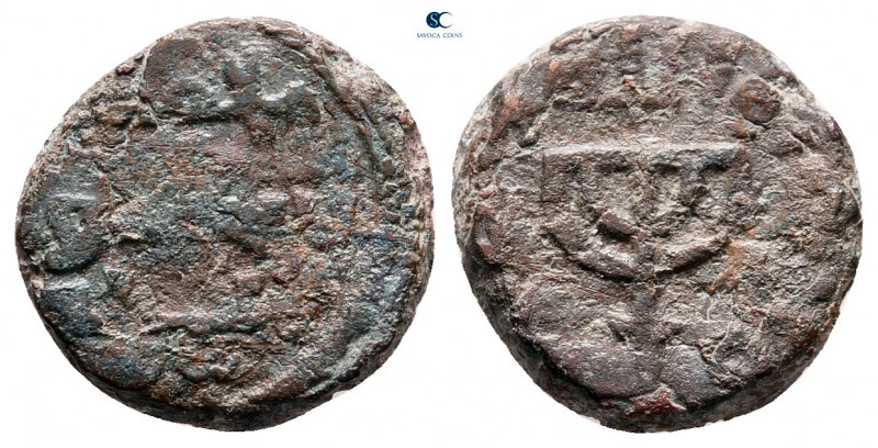 Umayyad Caliphate. Uncertain period. post-reform AH 77-132. 
Fals AE

13 mm, ...