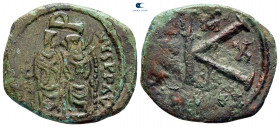 Justin II AD 565-578. Overstruck on 16 nummi of Justinian I. Thessalonica. Half Follis or 20 Nummi Æ