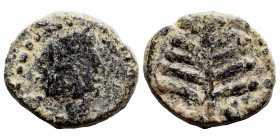 SYRIA, Seleucis and Pieria (?). Uncertain. Ae (bronze, 1.17 g, 12 mm). Tyche (?) to right, illegible legend around. Rev. Branch, pelleted border aroun...
