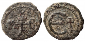 Maurice Tiberius, 582-602. Pentanummium (bronze, 1.28 g, 15 mm), Theoupolis (Antioch). Monogram 17. Rev. Large Є; cross to right. SB 542. Fine. Rare.