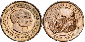 1878. Alfonso XII. Exposición Universal de París. Medalla. Variante en módulo. Bella. Ex Colección Jordana de Pozas. Bronce. 5,31 g. Ø24 mm. EBC.