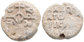 Byzantine Lead Seal ( 6th century)
Obv: Cruciform monogram
Rev: 3 (Three) lines of text.
(16,4 g, 27,4 mm diameter)