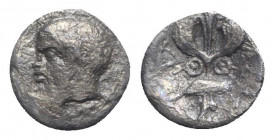 Sicily, Katane, c. 415/3-404 BC. AR Litra (11mm, 0.63g, 9h). Bearded head of Silenos l., wearing ivy wreath. R/ Winged thunderbolt flanked by shields....