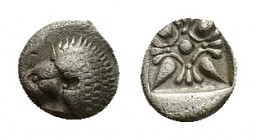 Ionia, Miletos, late 6th-early 5th century BC. AR Obol (7,08 mm, 0,66 g). Forepart of a lion r., head l. R/ Stellate ornament within square incuse. SN...