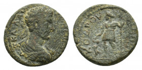 Uncertain Mint. Æ (23,64 mm, 8,80 g). Laureate, draped and cuirassed bust of the Antonine emperor r.(?). R/ Dionysus standing facing, head l., holding...