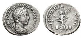 Elagabalus (AD 218-222). AR Denarius (19,18 mm, 2,97 g). Rome, AD 220-222. Laureate and draped bust r. R/ Victory advancing l. between two shields, ho...