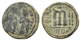 Phocas and Leontia. Æ 40 Nummi (25,42 mm, 9,36 g). Theoupolis, AD 605-606. Phocas and Leontia standing facing; the emperor, wearing crown with pendili...