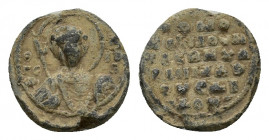 Byzantine Pb Seal, c. 10th-11th century (19mm, 5.94g). Nimbate bust of St. George, holding spear and shield. R/ Legend in six lines. Near VF