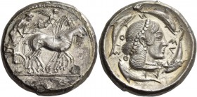 Syracuse. Tetradrachm circa 466-460, AR 17.12 g. Charioteer, holding kentron in r. hand and reins in l., driving slow quadriga r.; above, Nike flying ...