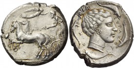 Syracuse. Tetradrachm circa 440-430, AR 17.27 g. Prancing quadriga driven l. by charioteer, holding kentron and reins; above, Nike flying r. to crown ...