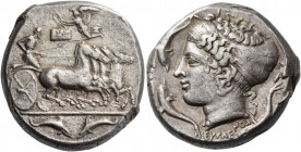 Syracuse. Tetradrachm signed by Eumenes and Euainetos circa 410, AR 17.39 g. Fast quadriga driven r. by charioteer holding reins and kentron. Above, N...