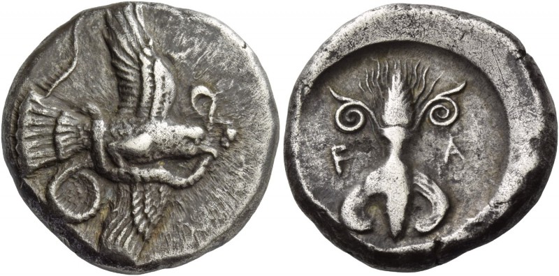 Olympia, Elis. Stater circa 450-440 BC, AR 12.27 g. Eagle flying r., grasping sn...