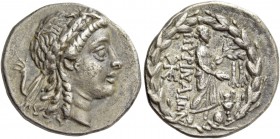 Myrina. Drachm circa 155-145, AR 3.82 g. Laureate head of Apollo r. Rev. MΥΡINAIΩN Apollo Grynius standing r. with laurel branch and patera; to r., om...