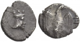 Judaea. The Coinage of Judah, Persian period circa 380 – 332 BC. Half gerah circa 380-332, AR 0.35 g. Head of the Persian king r., wearing jagged crow...