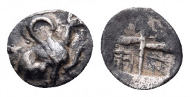 IONIA. Teos. Circa 460-420 BC. Tetartemorion (Silver, 7 mm, 0.23 g). Griffin seated right, raising left forepaw. Rev. Quadripartite incuse square. Bal...